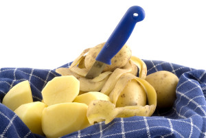 peeling potatoes with a potatoes-peeler london job 